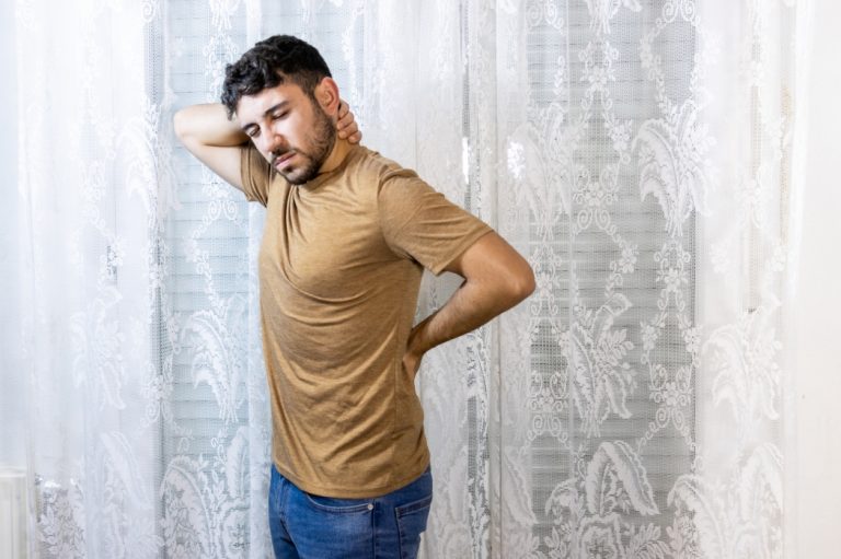 A man suffers from back pain.