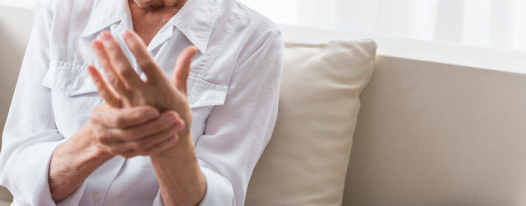 Woman is suffering from arthritic aches and pains and requires physical therapy
